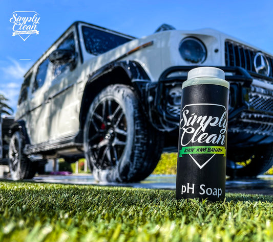 Simply Clean Kikn Kiwi Banana PH Soap in a vibrant car detailing setup.